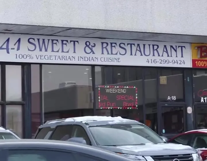 The A1 Sweet & Restaurant storefront at 3300 McNicoll Ave, with cars parked out front